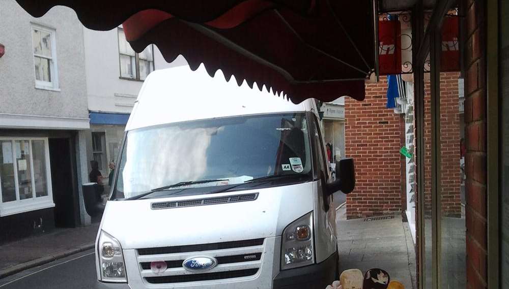 A van parked on the pavement and damaged the sun blind outside The Sweet Shop in King Street