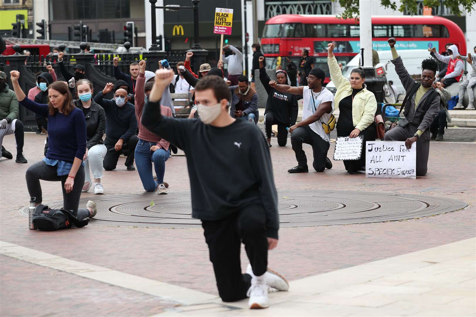 People take a knee during a Black Lives Matter protest (Yui Mok/PA)