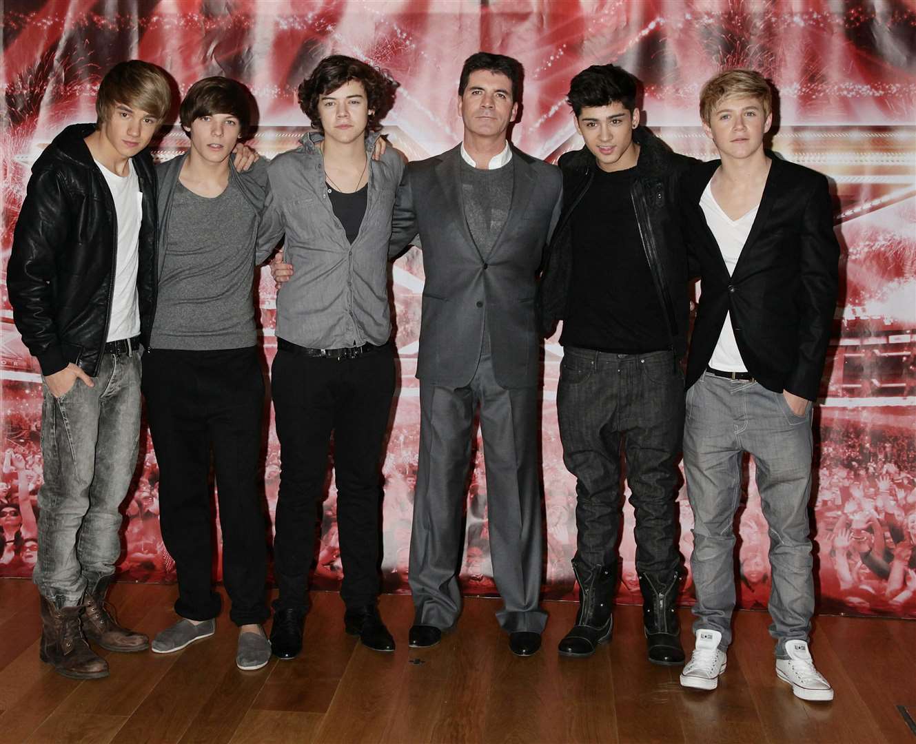 Simon Cowell with One Direction (from left) Liam Payne, Louis Tomlinson, Harry Styles, Zayn Malik and Niall Horan as finalists on The X Factor (Yui Mok/PA)