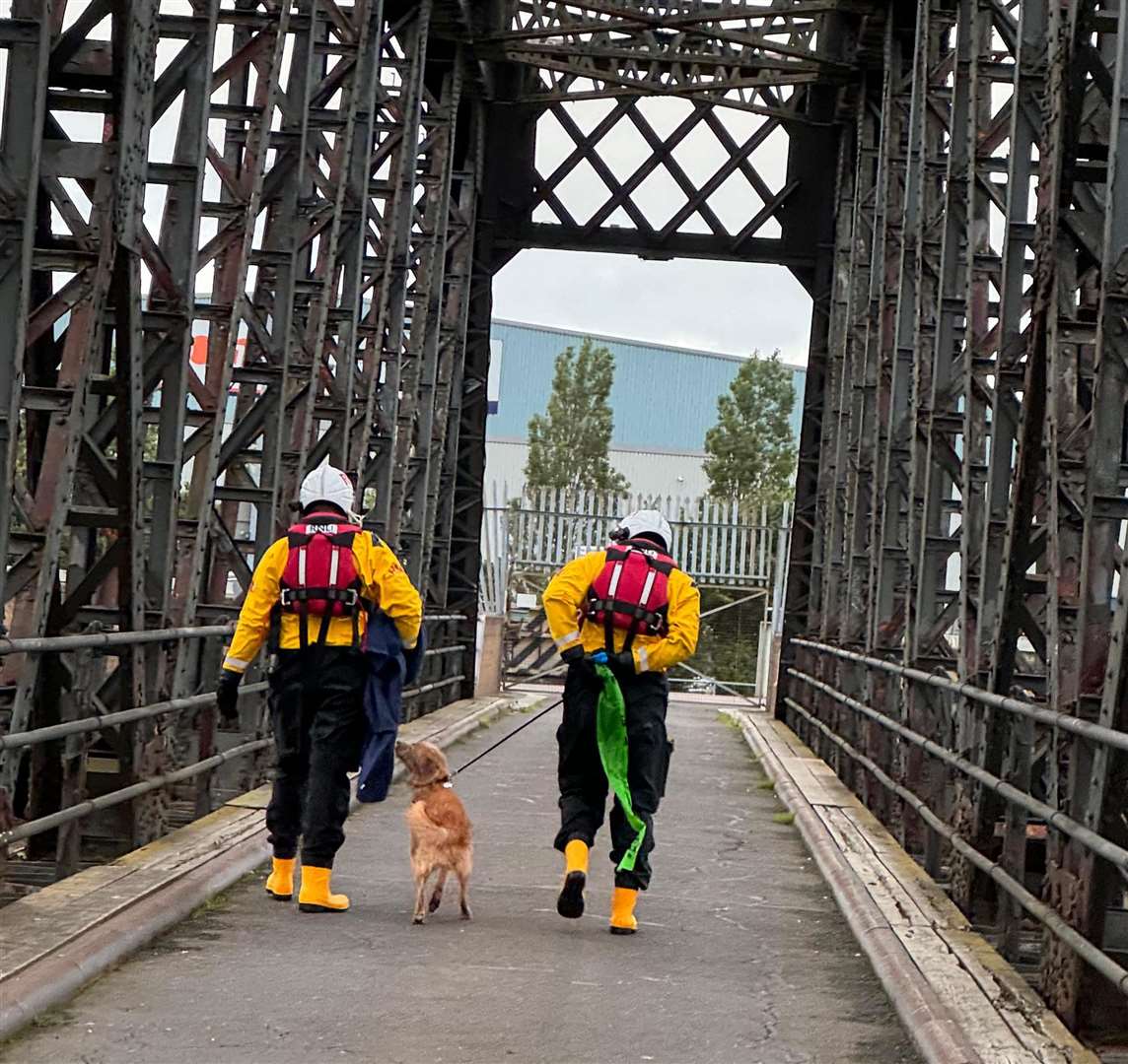 Back on dry land - Freddie with the RNLI crew who saved his life. Photo: Chris Tuner