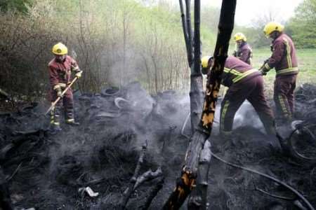 Firefighters make sure the blaze is completely put out. Picture: DAVID ANTHONY HUNT