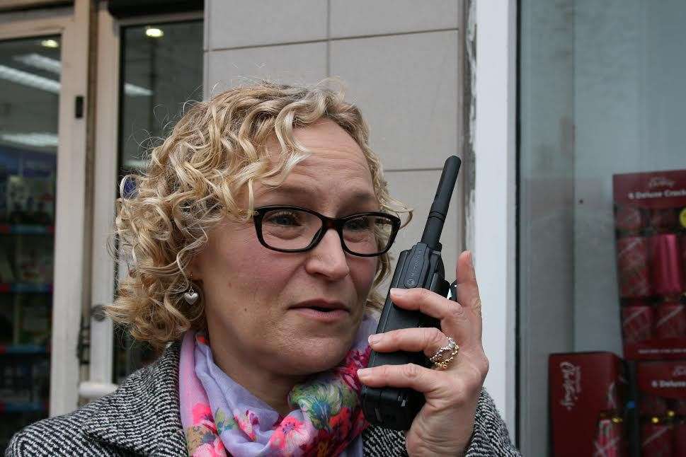 Jenny Bravery, who runs Swale Safe, using one of the walkie-talkies