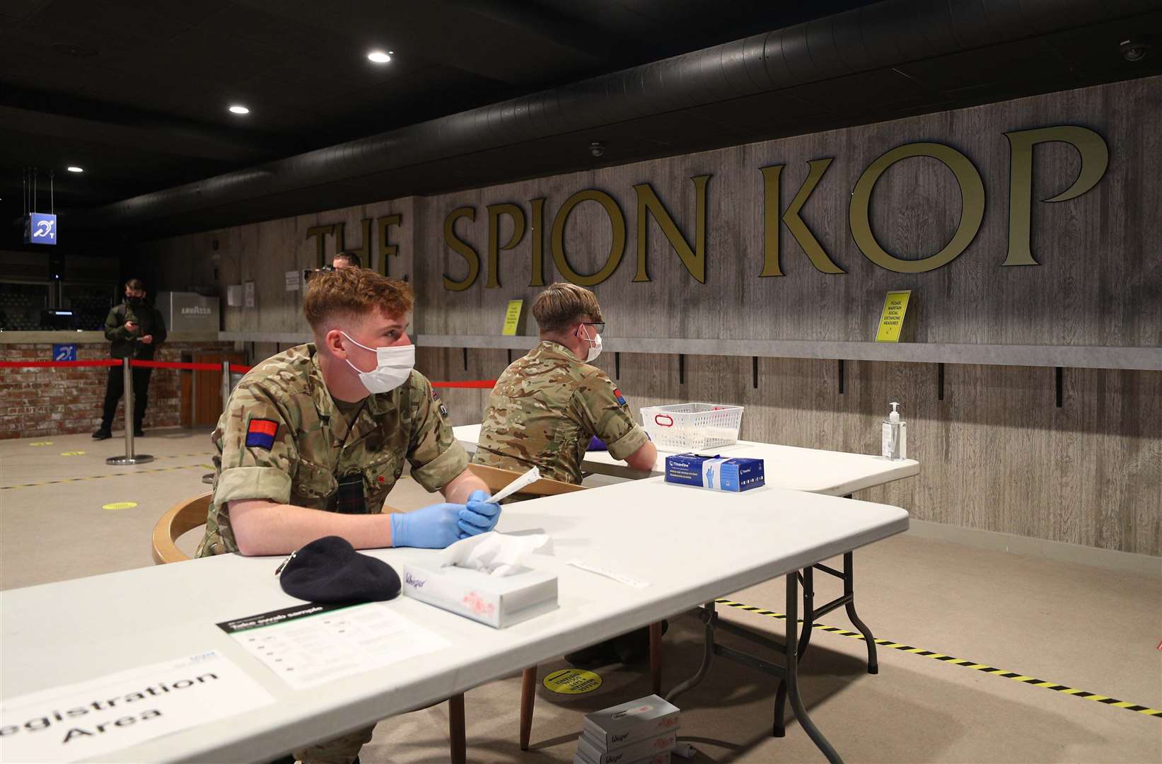 Members of the military use Anfield stadium as part of the mass testing taking place in the city of Liverpool (Peter Byrne/PA)