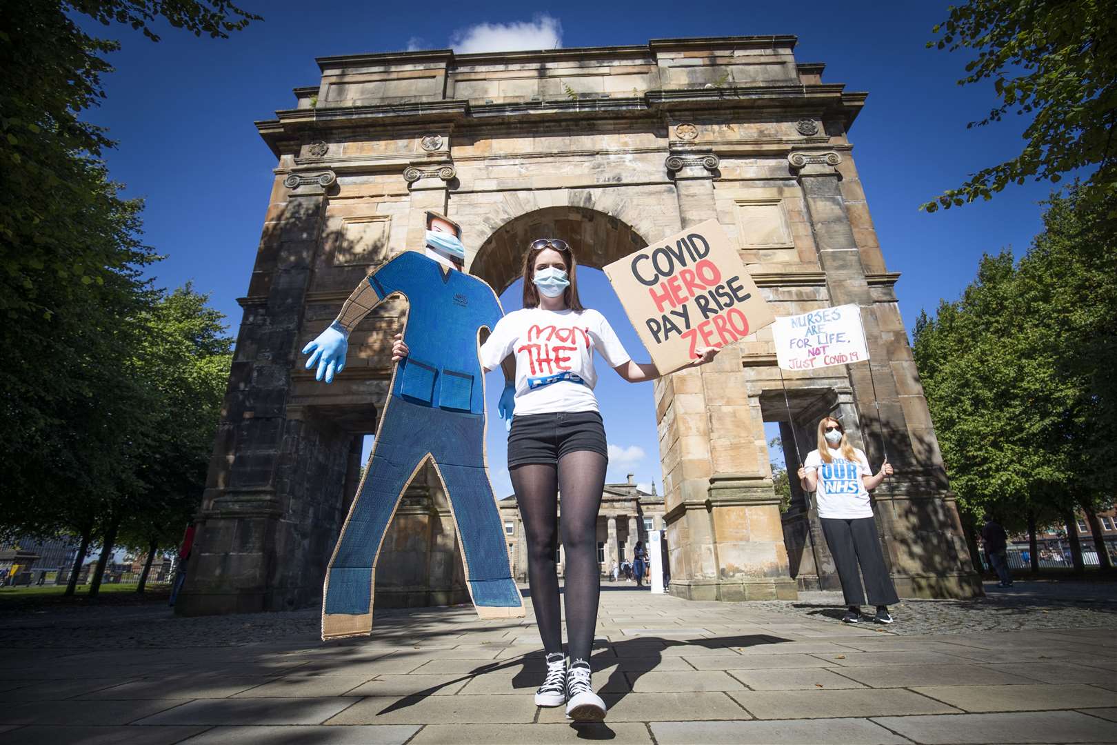 Many of those at the demonstration in Glasgow Green held banners and signs (Jane Barlow/PA)