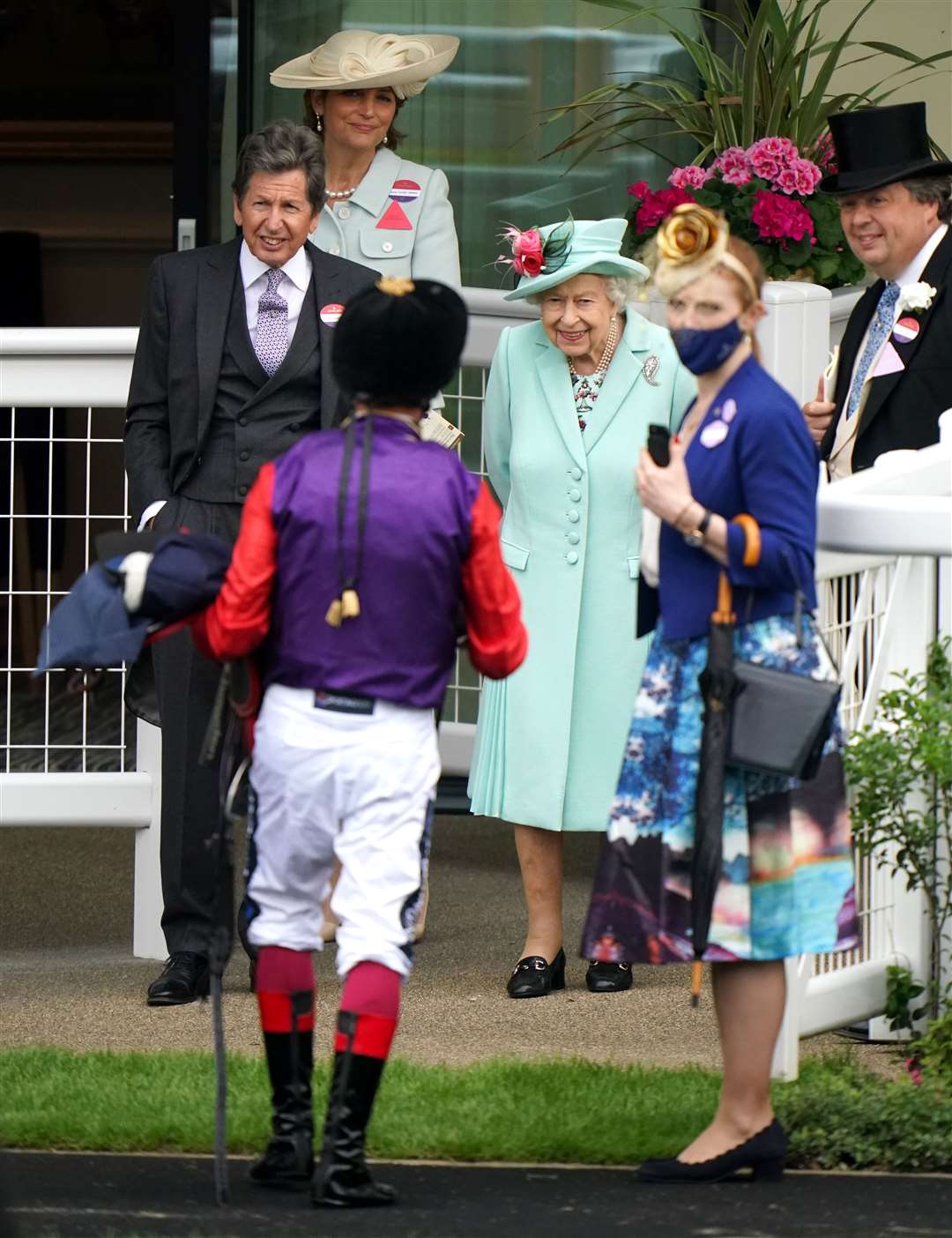 The Queen with racing manager John Warren and jockey Frankie Dettori (Andrew Matthews/PA)