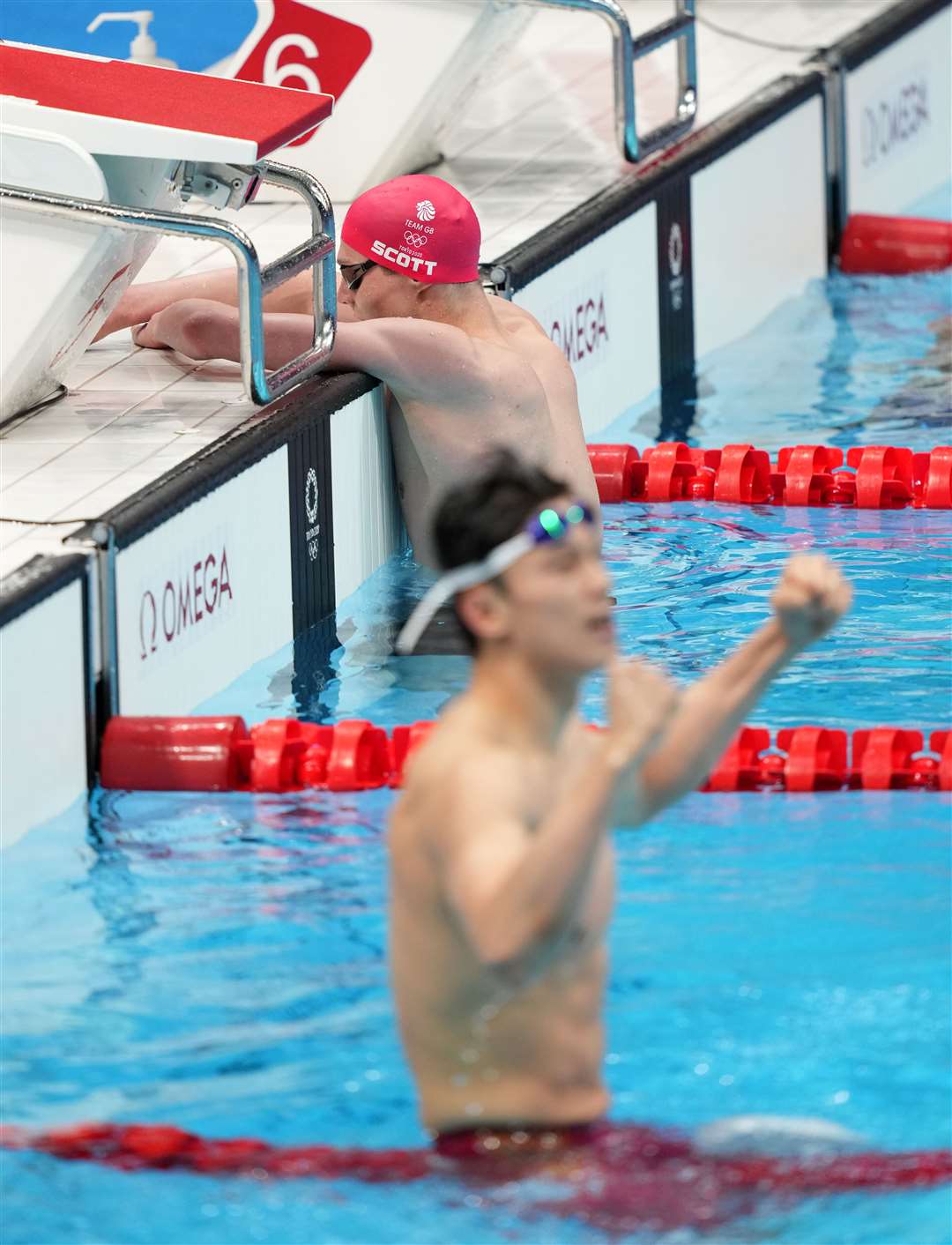 Duncan Scott reflects on another silver medal as China’s Wang Shun celebrates gold (Joe Giddens/PA)