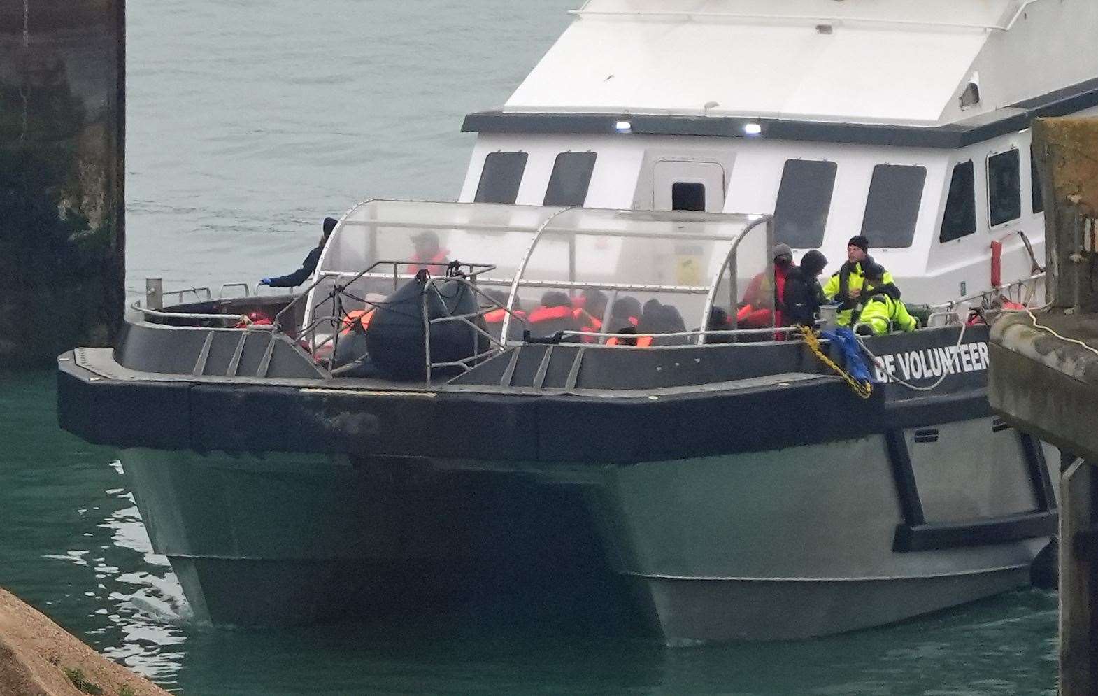 A group of people thought to be migrants are brought in to Dover, Kent, on board a Border Force vessel following a small boat incident in the Channel (Gareth Fuller/PA)