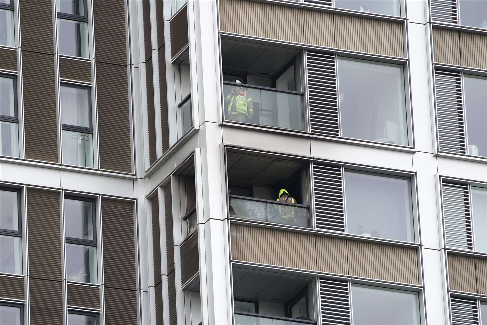 Members of the emergency services at the scene of a fire at a tower block on Deacon Street (Kirsty O’Connor/PA)