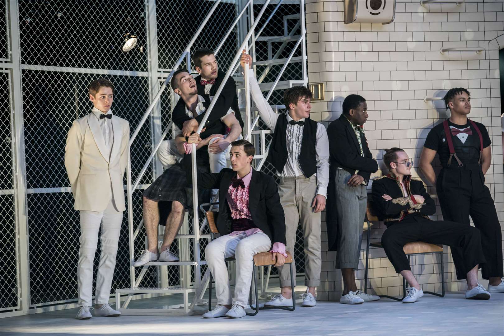 The boys encourage Romeo to speak to Juliet in Matthew Bourne's Romeo and Juliet at the Marlowe Theatre. Credit: Johan Persson