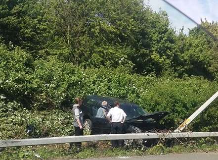 The car collided with a safety barrier and overturned into a ditch. Picture: Stephanie Chalmers