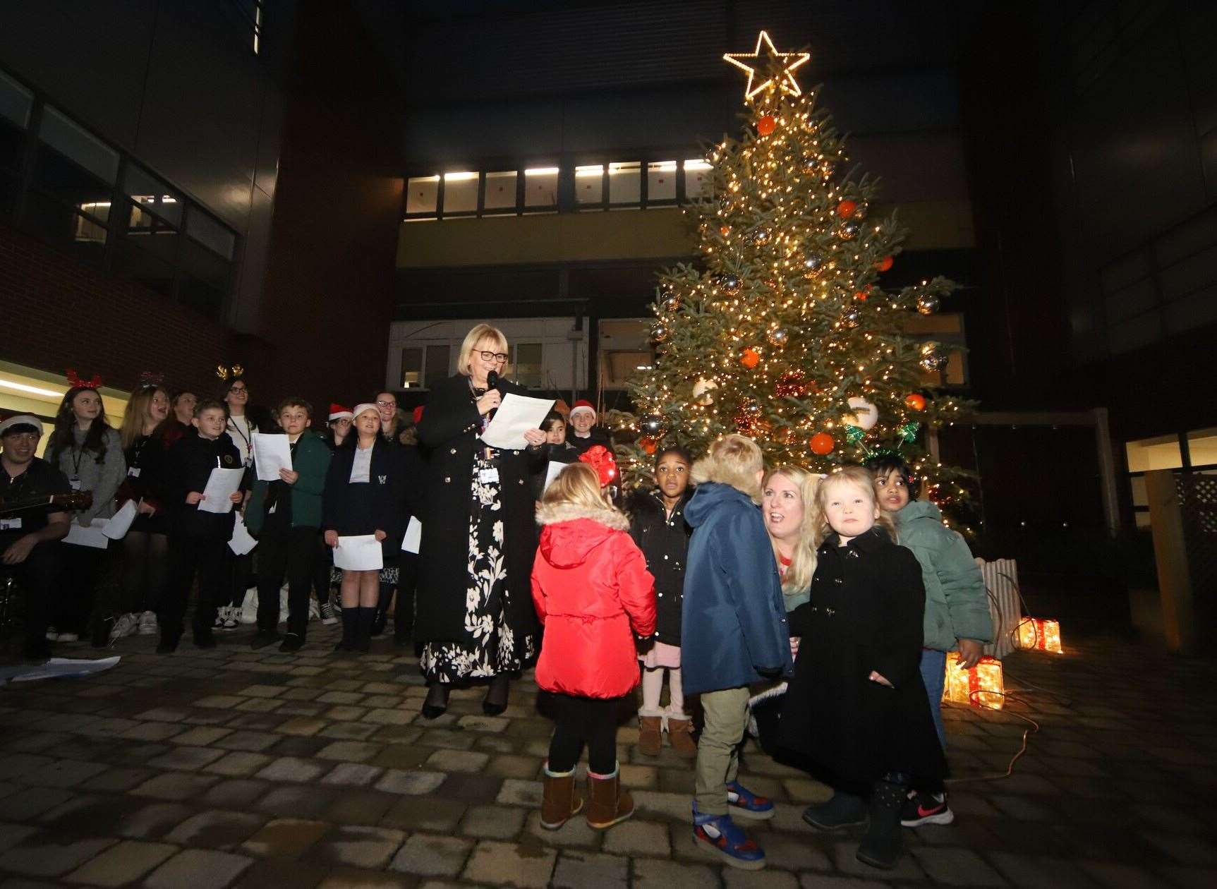 The kids from Tiny Tugs turn on the Christmas lights