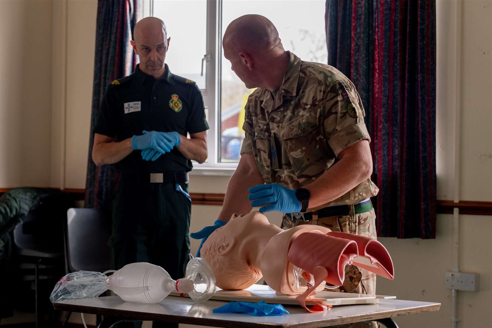 A soldier from the Royal Signals being mentored by an NHS representative in dealing with airways (Cpl Watson P R/ MoD Crown Copyright/PA)