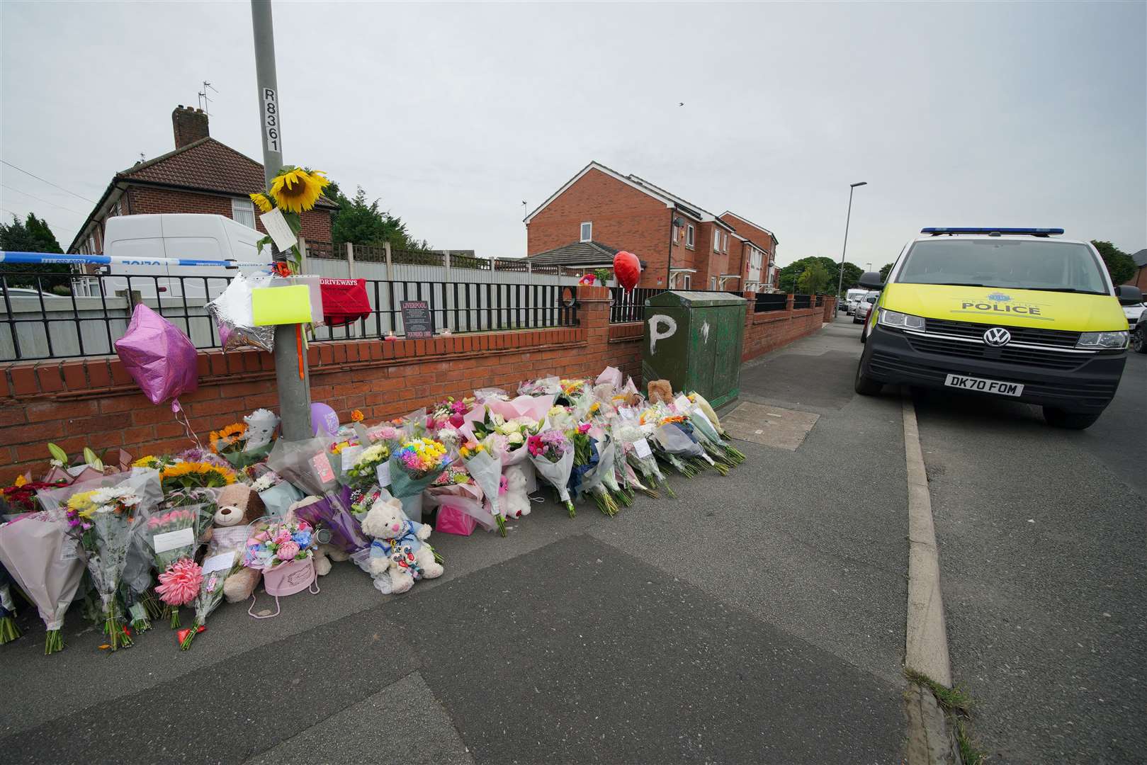 Flowers left near the scene (Peter Byrne/PA)