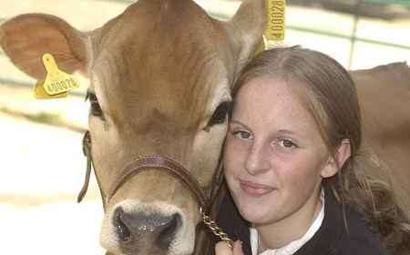 FARMING FRIENDS: Young farmer Jennifer Mayes, from Angley School, Cranbrook, prepares Blossom for the show. Picture: GRANT FALVEY