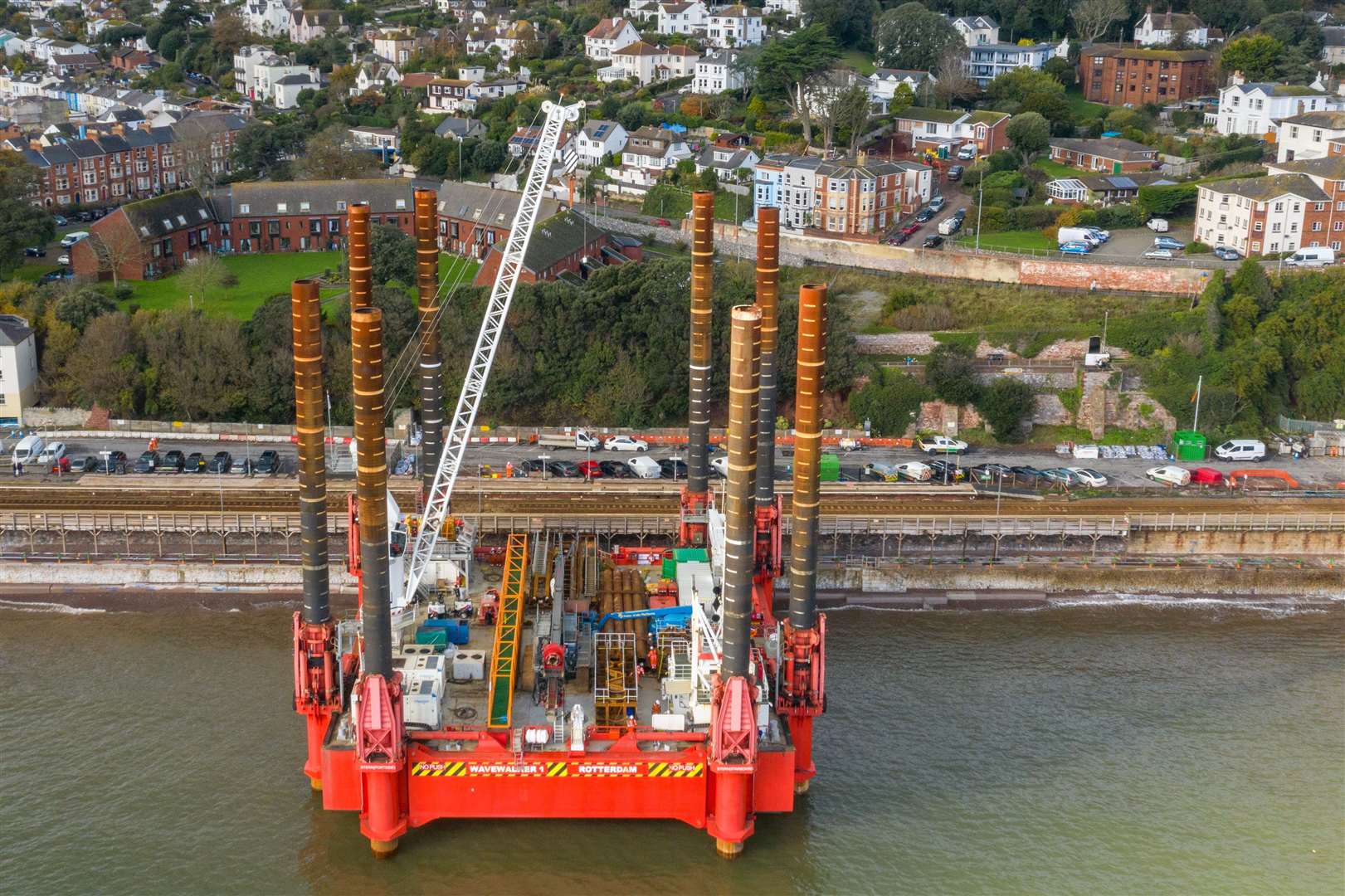 A huge construction machine at Dawlish train station where work has begun building a new and bigger sea wall to protect the railway and town from rising sea levels (Ben Birchall/PA)