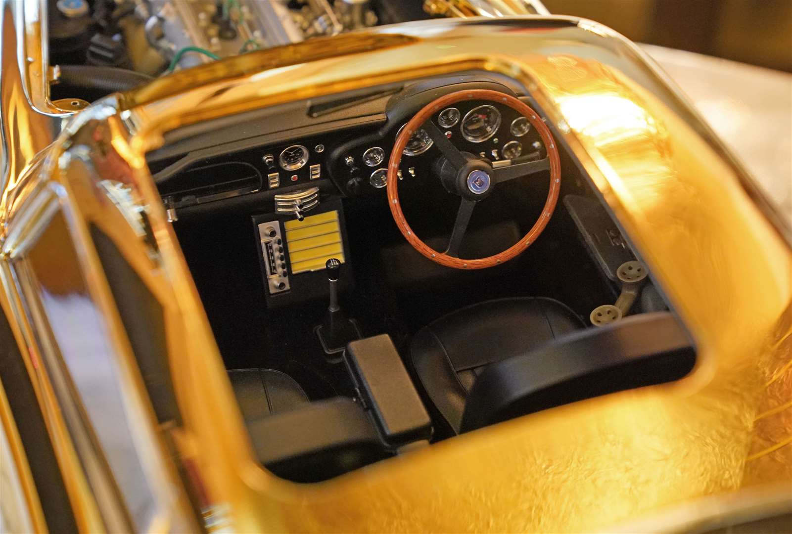 The interior of a 24-carat gold-plated model of James Bond’s Goldfinger Aston Martin DB5 (Jonathan Brady/PA)