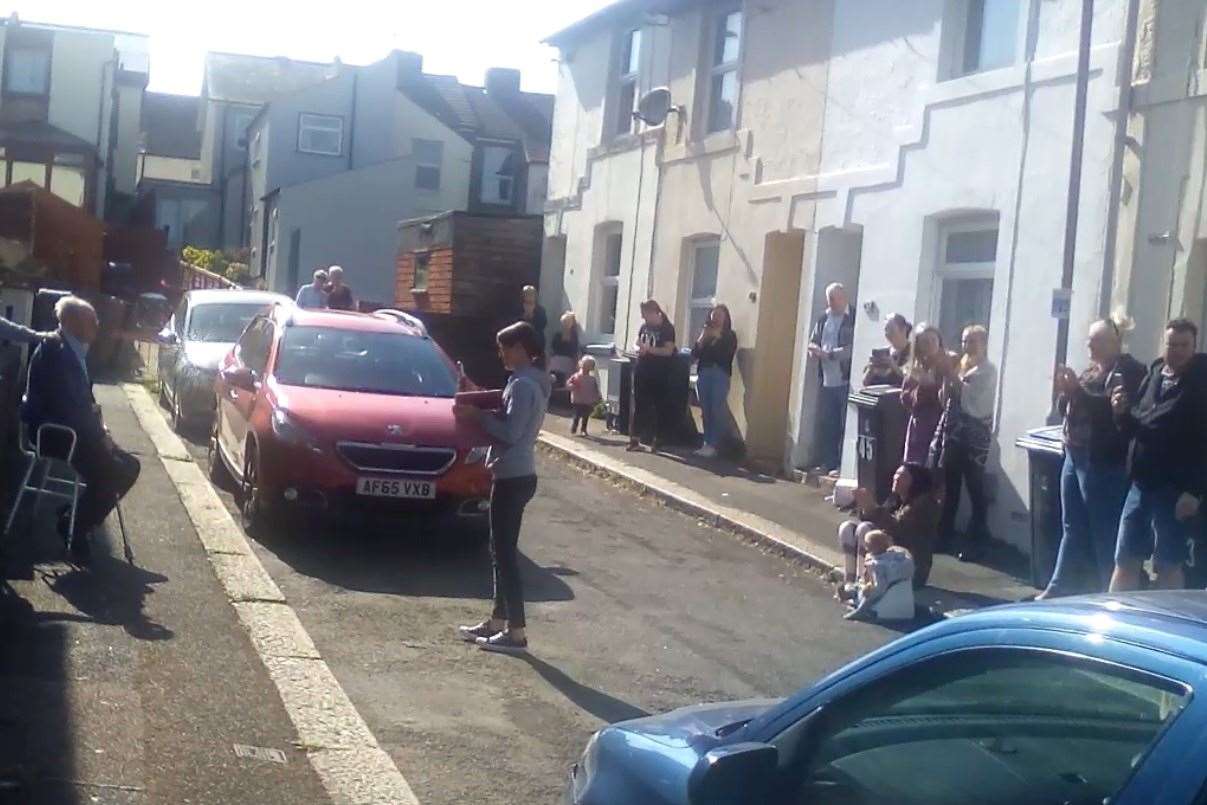 Dickson Road residents singing Happy Birthday to Harold Reed on his birthday last April.