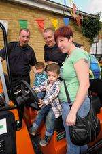 Oliver Smith, 3, with his mum Natalie Smith and cousin Finley Barton, 2, on the Fire Launch with Eastchurch crew Dylan Collard, left, and Darren Patrick