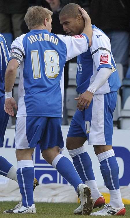 Danny Jackman congratulates Simeon Jackson on his opening goal against Huddersfield as Mark Stimson's gruelling training schedule paid dividends. Picture: Barry Goodwin