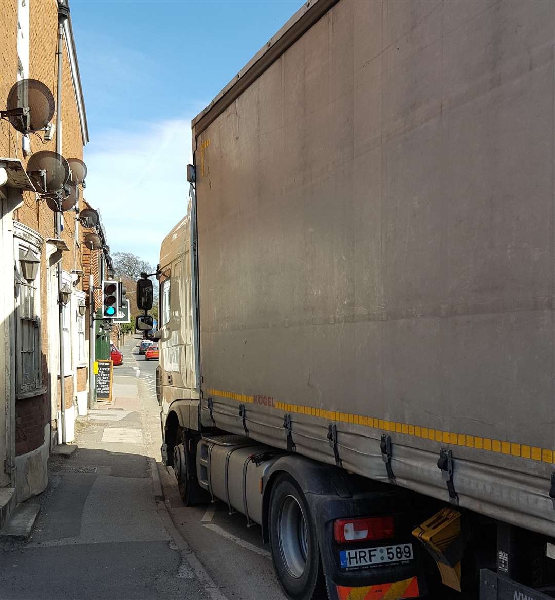 A lorry travels close to homes on the A2