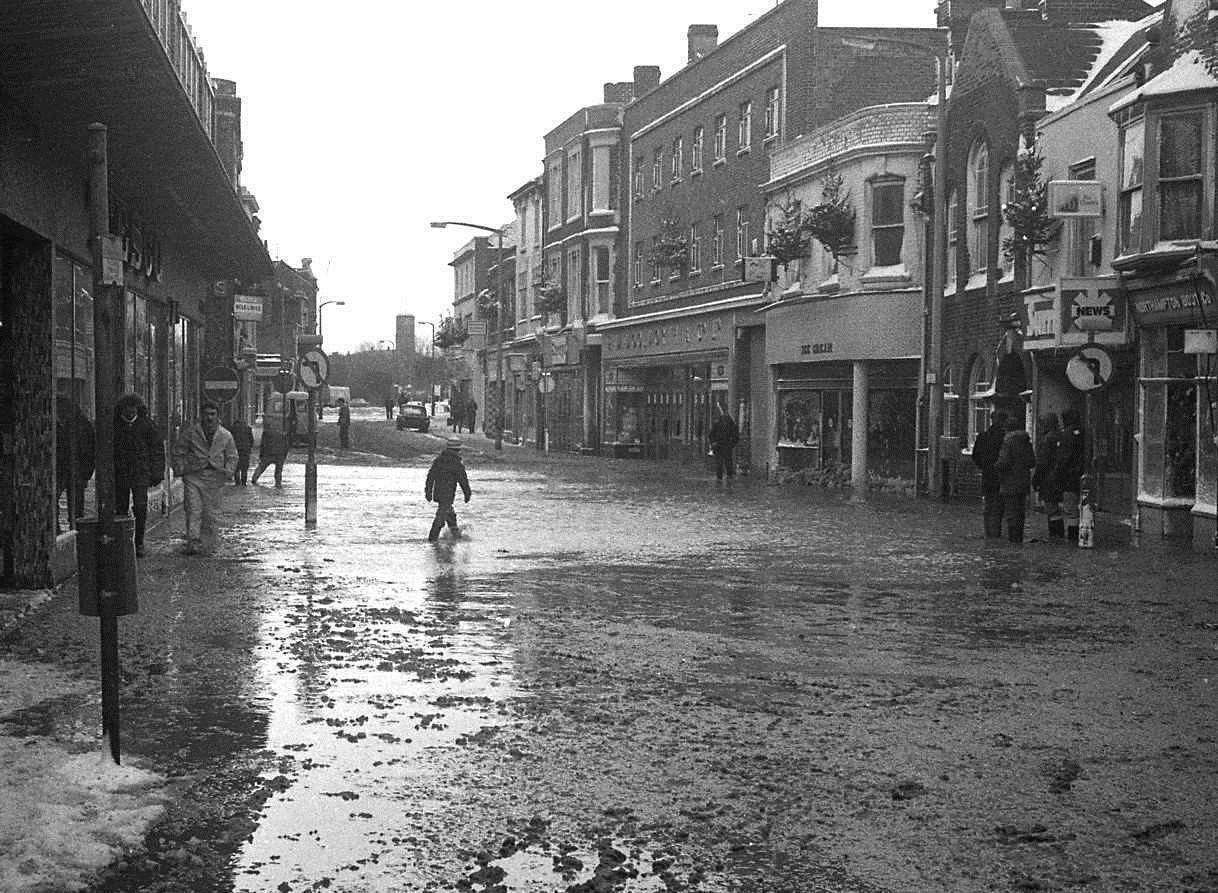 Sea water in the High Street outside what was Woolworth, Tesco and Risi's ice-cream parlour - now the Times Guardian offices - in January 1978. Picture: Tim Oxley