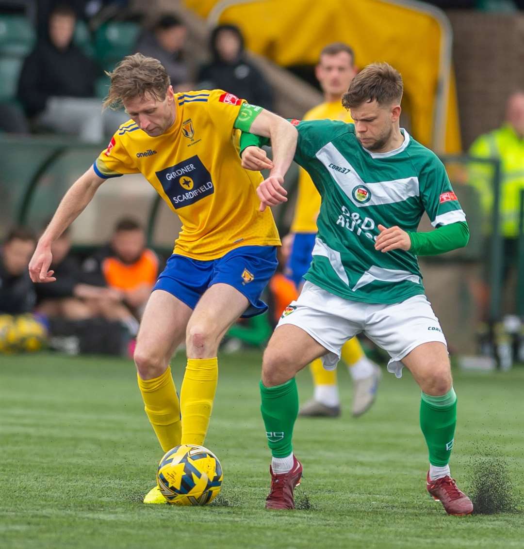 Ashford midfielder Henry Muggeridge pays close attention. Picture: Ian Scammell