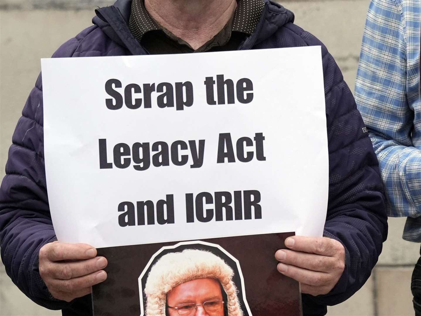 A protester outside the Court of Appeal at the Royal Courts of Justice in Belfast (Brian Lawless/PA)