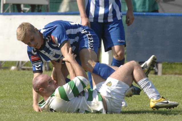 Herne Bay midfielder Ben Brown in action during a match at Winches Field