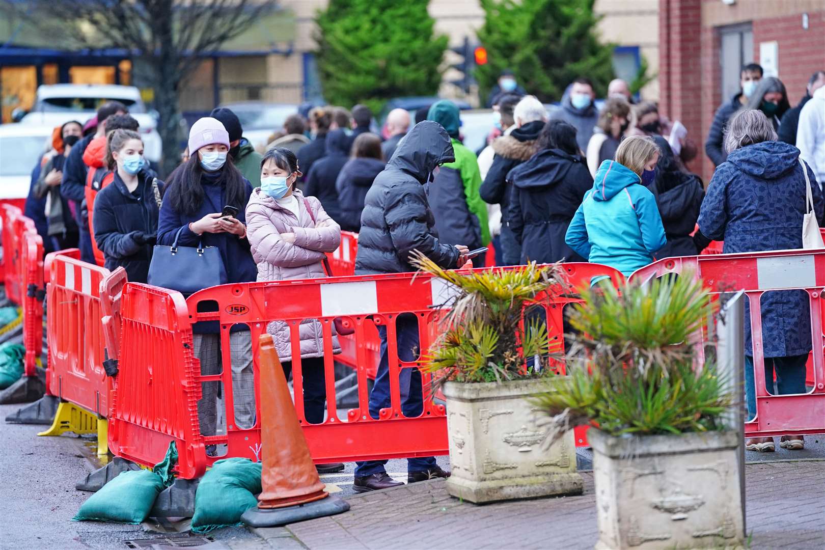 People queue outside a vaccination clinic at the Glasgow Central Mosque (Jane Barlow/PA)