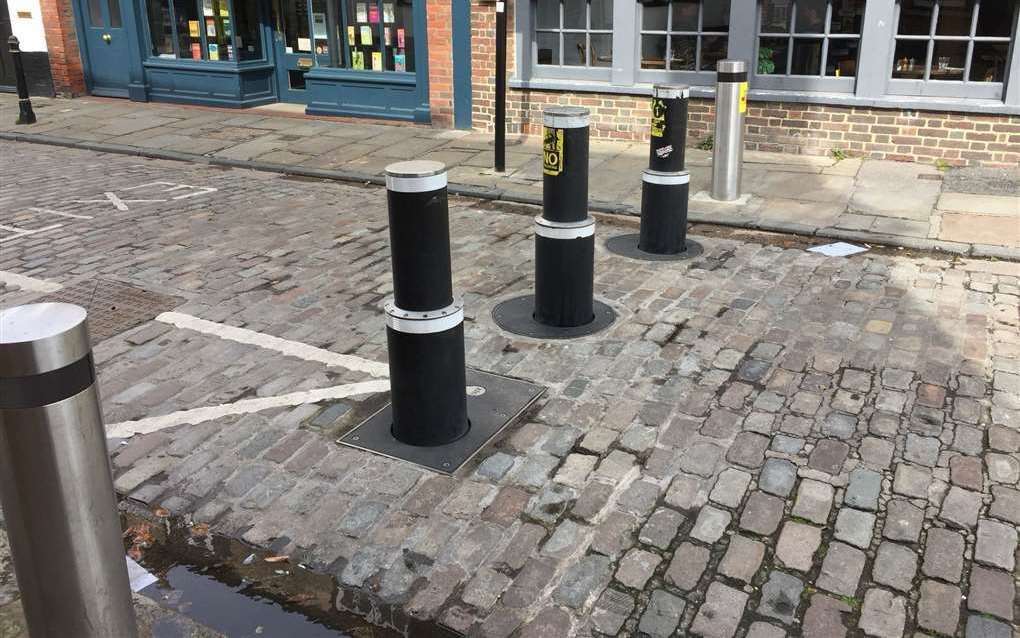 Clear signage tells motorists when to go through the bollards and to avoid tailgating