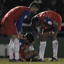 Bradley Dack is injured at Rochdale