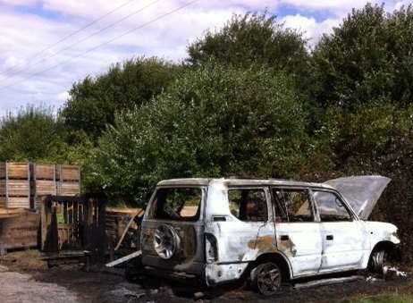 The burnt shell of the 4x4. Picture: John Wilson