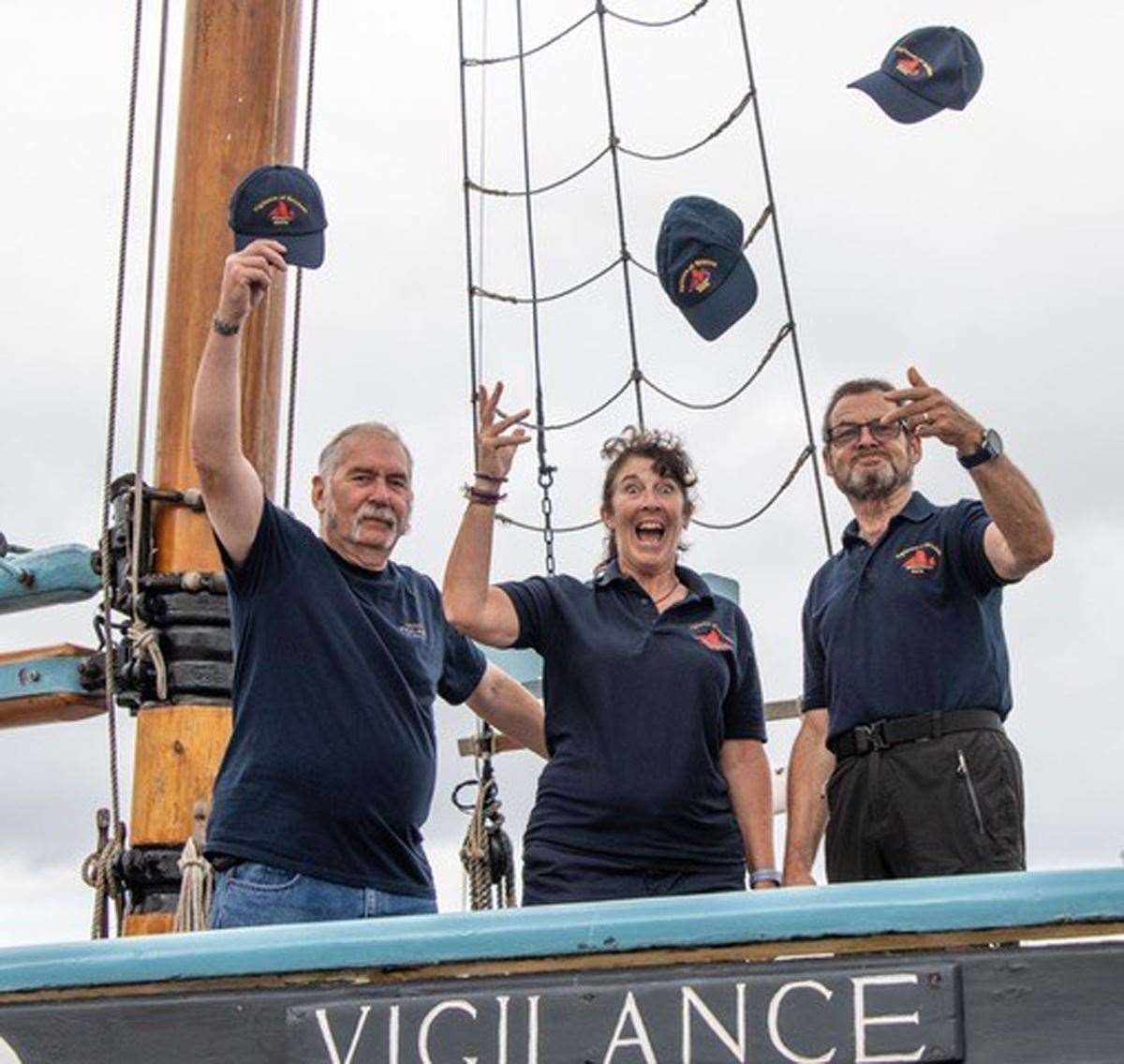 Volunteers Tony Bridle (mate), Caroline Griffiths (crew) and Nigel Gooding (finance director) celebrate news of the grant (Trevor Taylor/Friends of Vigilance/PA)