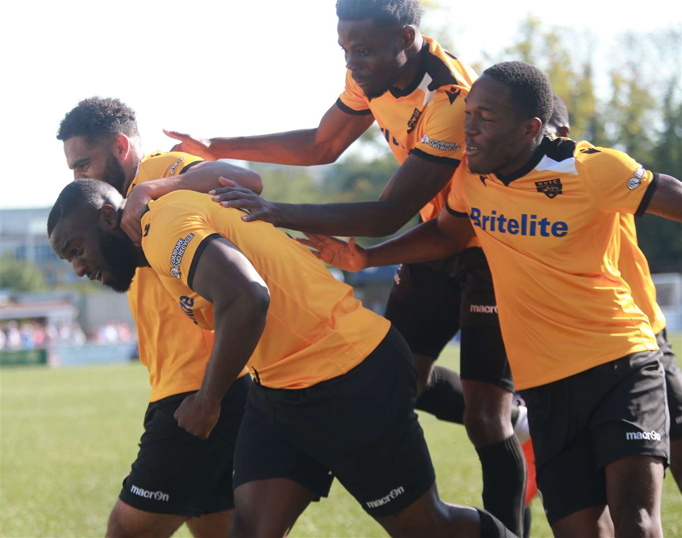 Ibby Akanbi is mobbed by Maidstone team-mates after scoring against Chelmsford Picture: John Westhrop