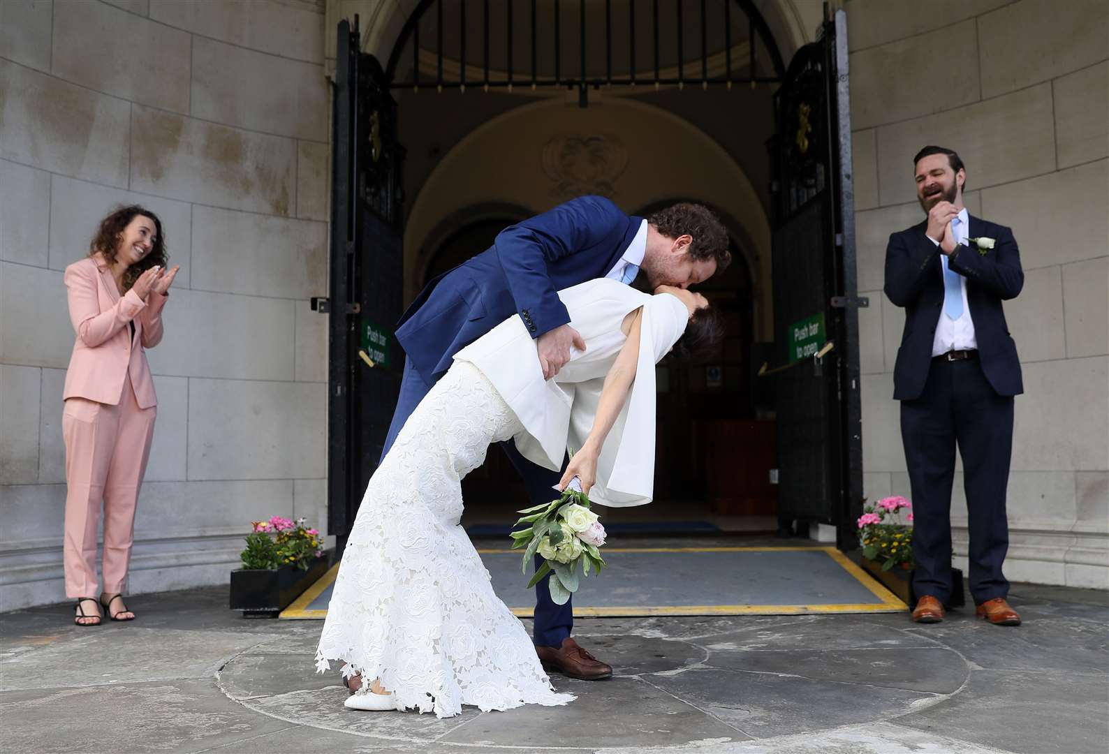 Michael McCaw and Lucrecia Landeta Garcia following their wedding ceremony at City Hall in Belfast (Brian Lawless/PA)