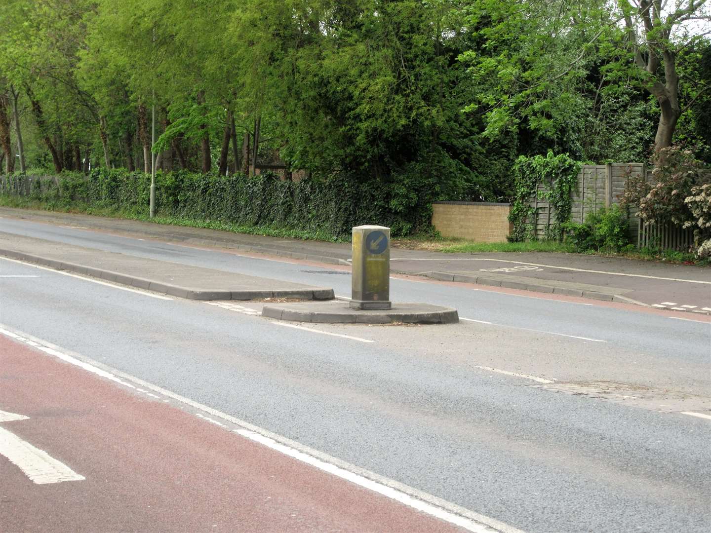 A dirt encrusted traffic bollard in Canterbury Road