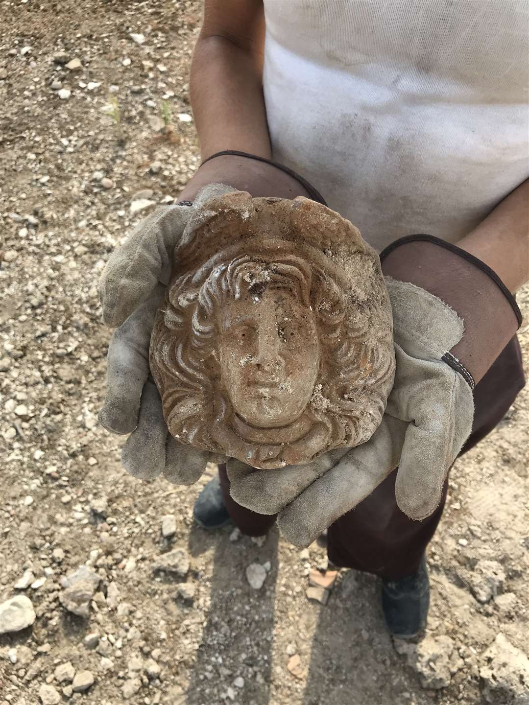 A Gorgon antefix found at the site (Alessandro Launaro/University of Cambridge/PA)