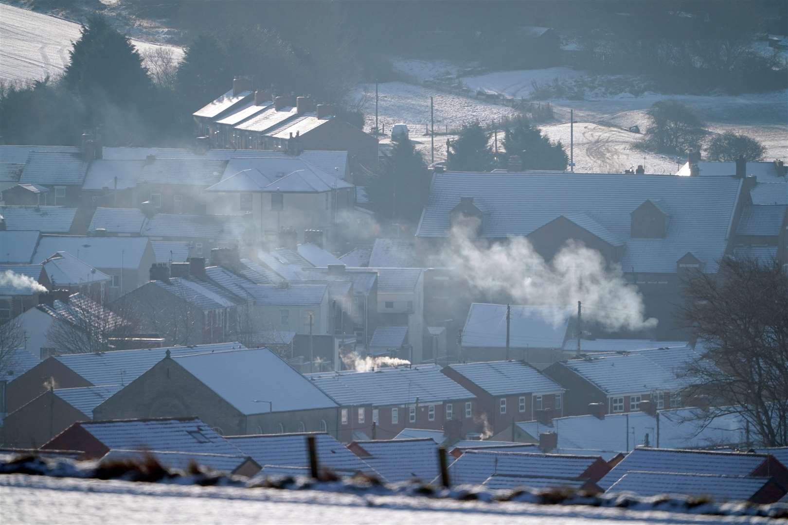 Snow on rooftops in Bishop Auckland, County Durham (Owen Humphreys/PA)