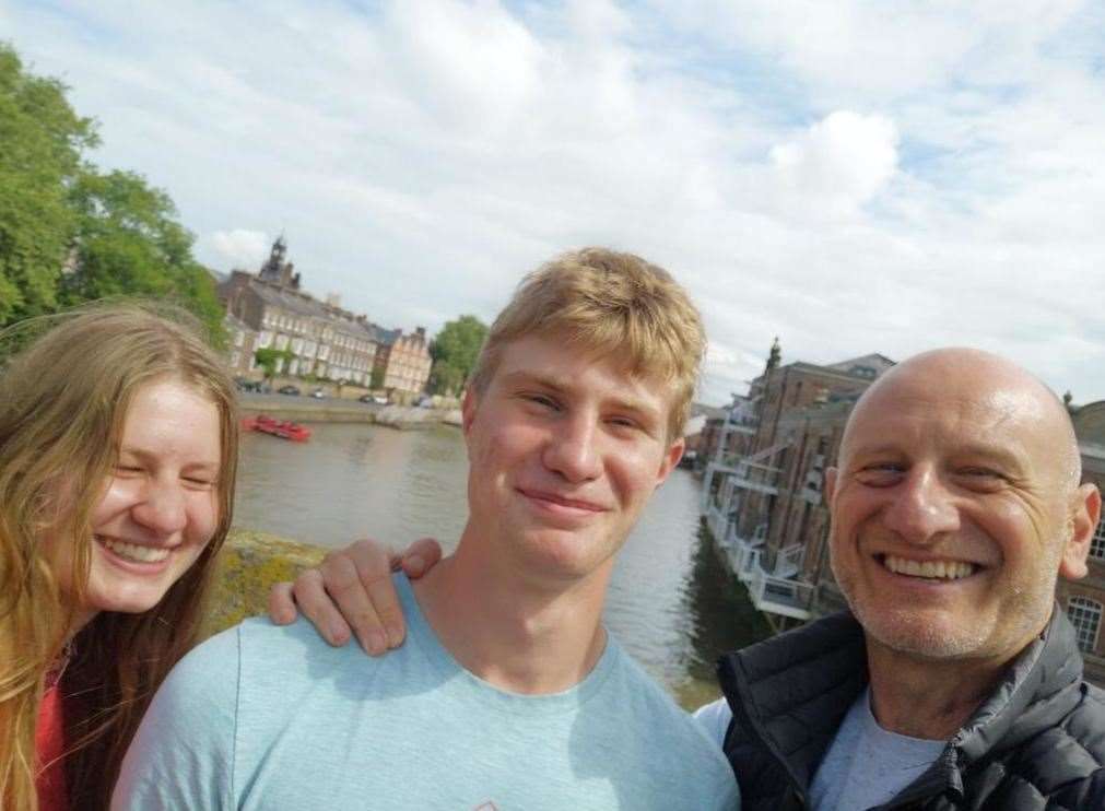 Julien and his two eldest children have undertaken a gruelling hiking challenge to raise money for bereavement charity Holding On Letting Go. Picture: Holding On Letting Go