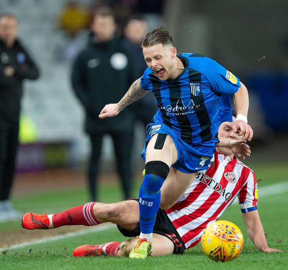 Gillingham's Mark Byrne is challenged at Sunderland Picture: Ady Kerry (7320590)