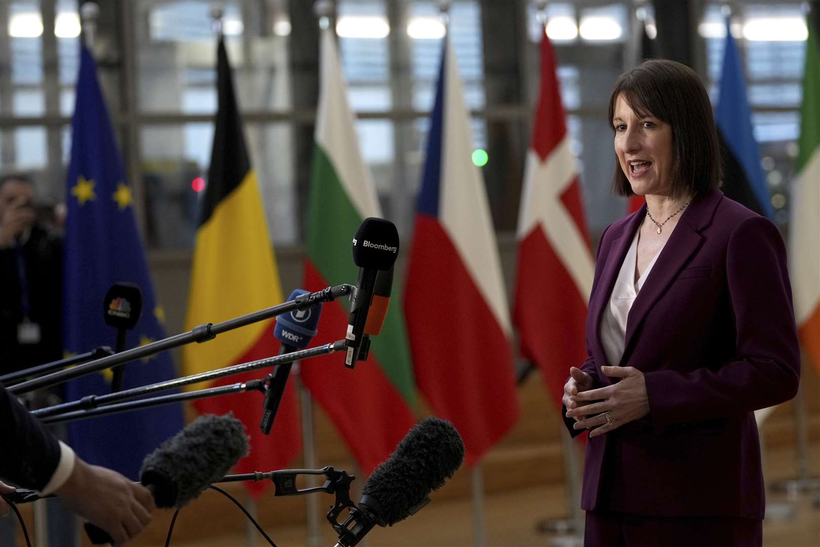 Chancellor Rachel Reeves speaks to the media as she arrives for a meeting of eurozone finance ministers at the European Council building in Brussels (Virginia Mayo/AP)