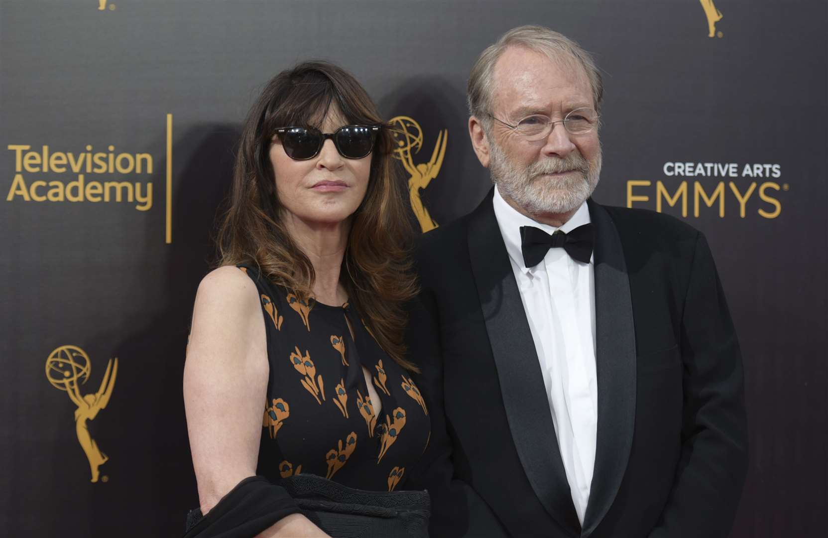 FILE -Wendy Haas, left, and Martin Mull arrive at night one of the Creative Arts Emmy Awards in 2016 (Richard Shotwell/Invision/AP, File)