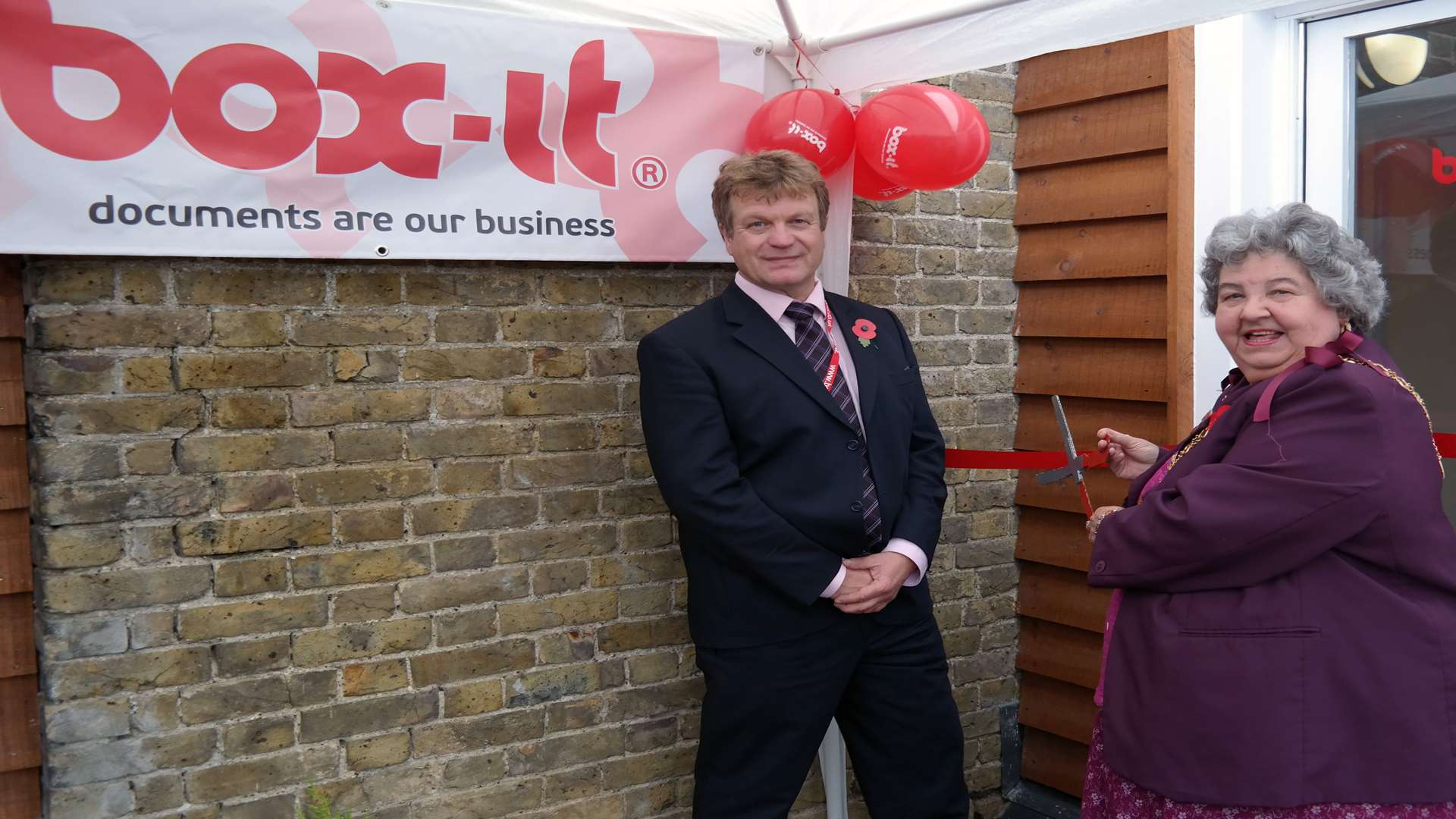 Mayor of Swale, Cllr Anita Walker, cuts the ribbon on the new Box-it office managed by James Mair