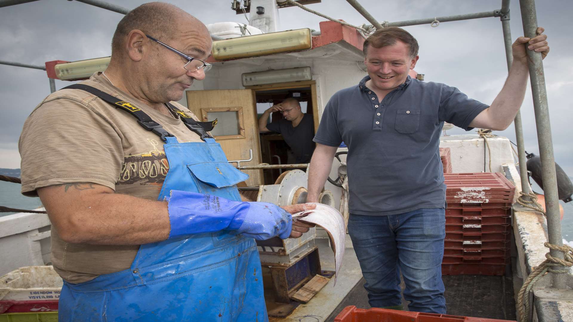 Campaigning fishermen Terry Noakes and his son Luke took MP Damian Collins out to sea. Picture: Andrew Aitchison