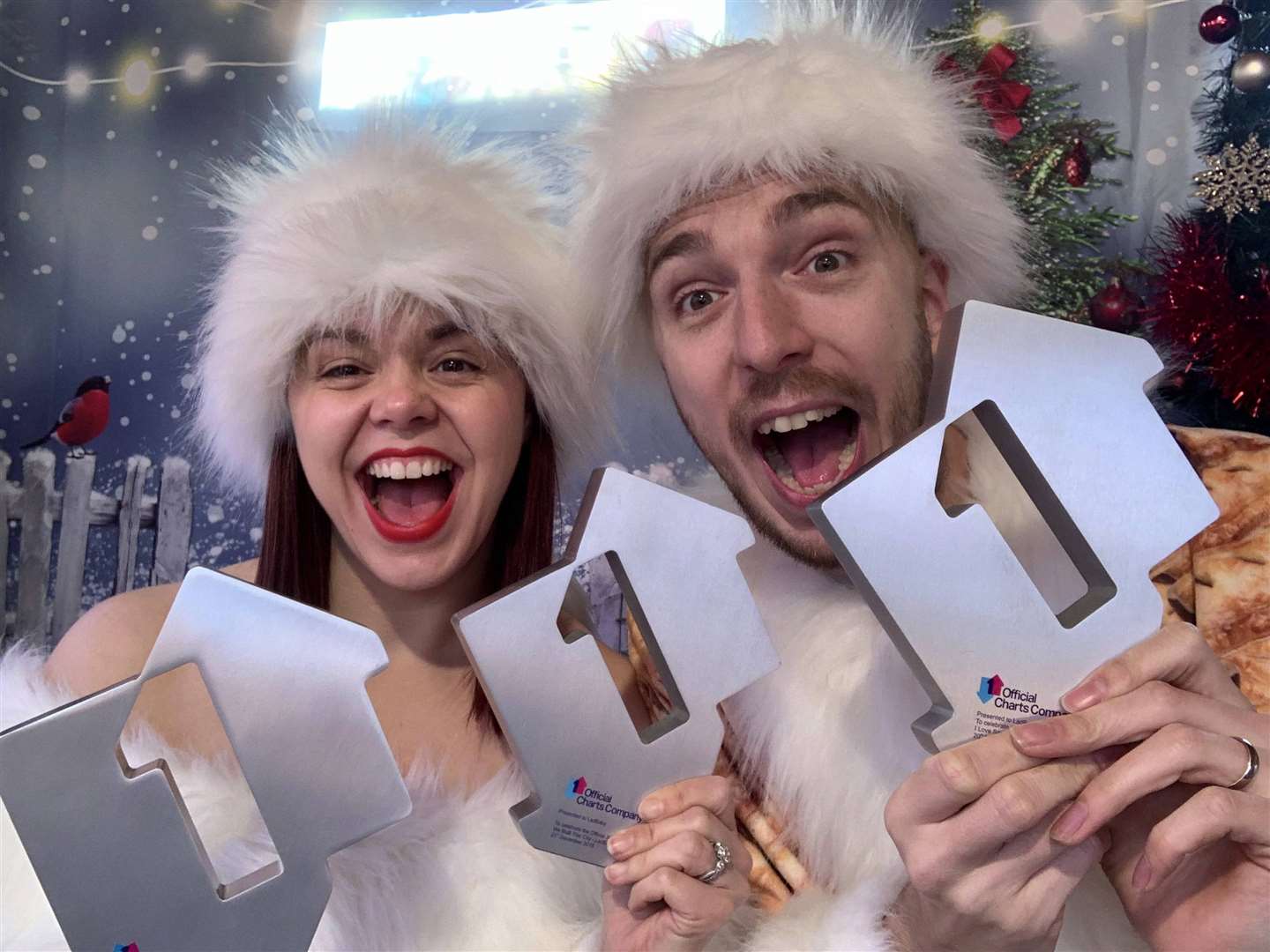 LadBaby, real name Mark Hoyle, celebrating with his wife Roxanne Hoyle, after his song Don’t Stop Me Eatin’ topped the singles charts for Christmas (OfficialCharts.com/PA)