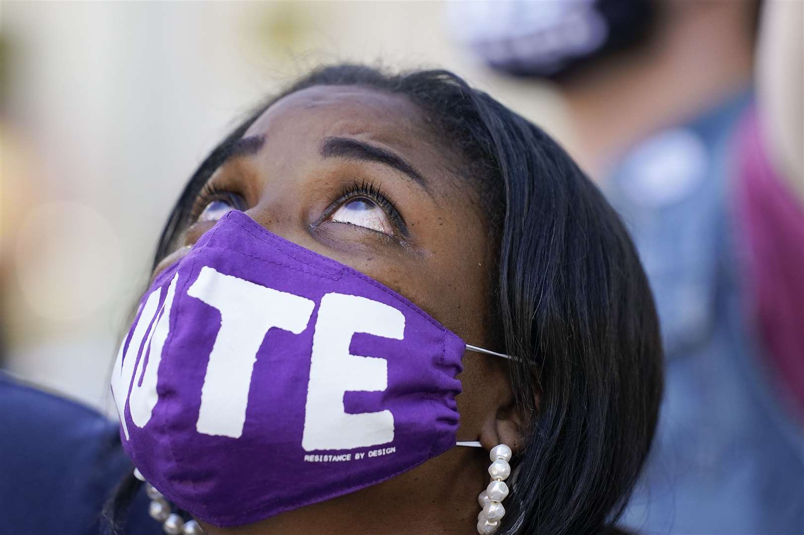 Janice Jamison reacts after hearing the announcement that Joe Biden had defeated Donald Trump (Alex Brandon/AP)