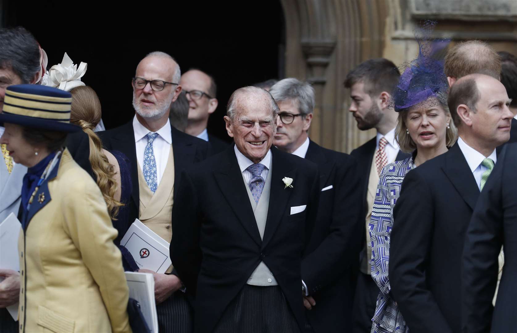 Britain’s Prince Philip stands with other guests as they leave following the wedding of Lady Gabriella Windsor and Thomas Kingston at St George’s Chapel, Windsor Castle (PA)