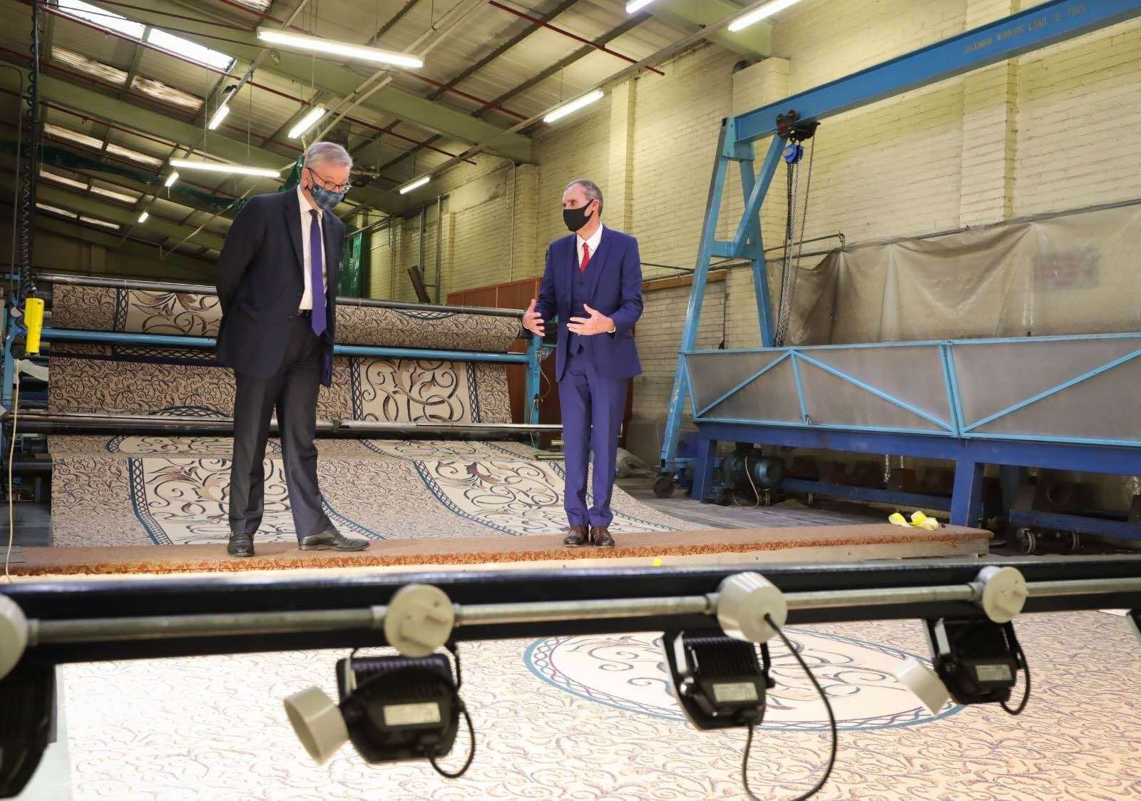 Michael Gove, left, visited the Ulster Carpets factory in Portadown (Kelvin Boyes/Press Eye/PA)