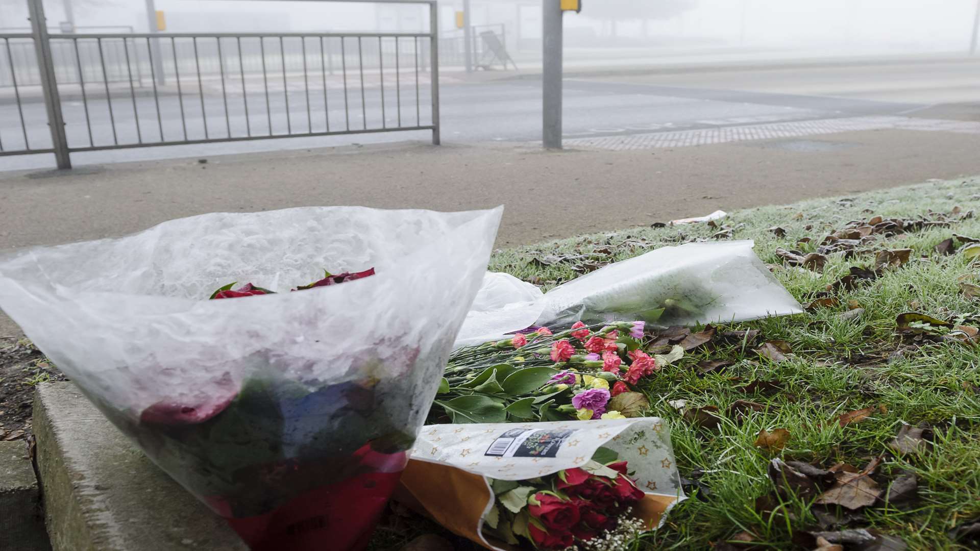 A few floral tributes at the scene