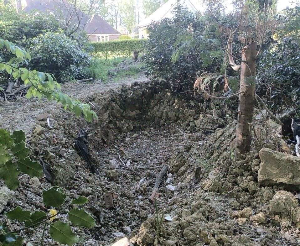 A hole left in the garden of Sandra and Stephen West's home in Benenden, near Tunbridge Wells. Picture: SWNS